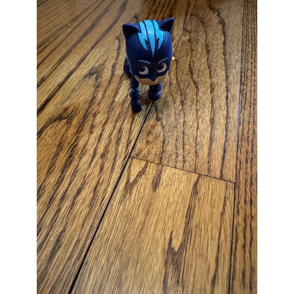 PJ Masks Catboy toy figurine holding a Mystery Mountain scroll